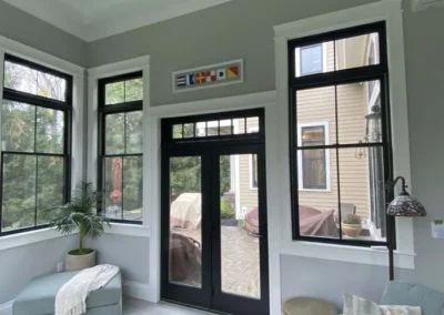 Interior room with large windows, a plant, and outdoor view